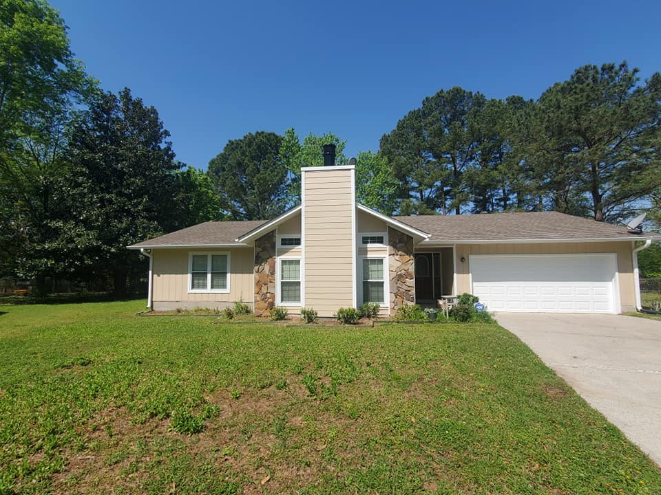 Gray-painted exterior home siding with white trim